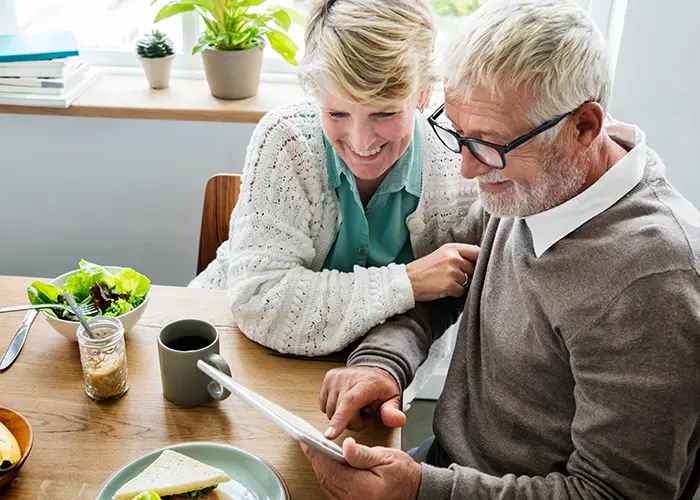 Retirement age couple going over financial documents