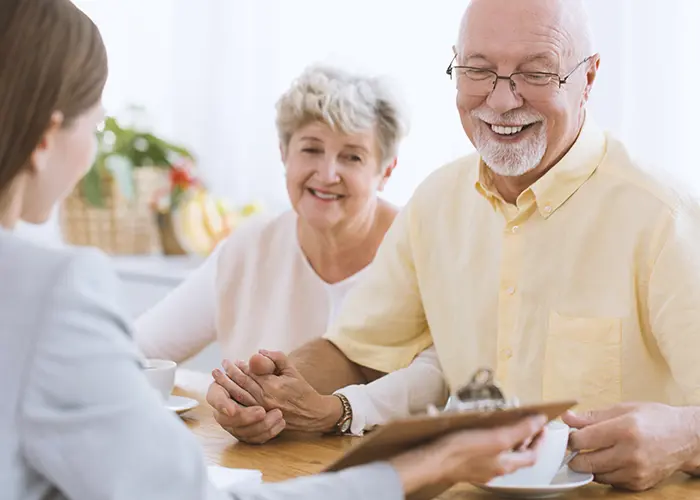 Older couple planning for retirement with financial advisor