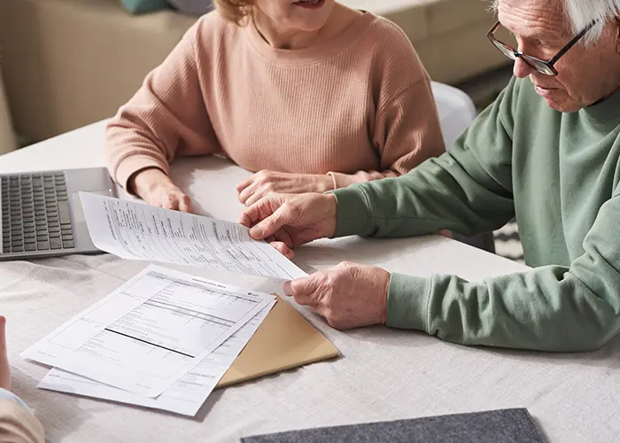 Retired couple looking at annuity documents