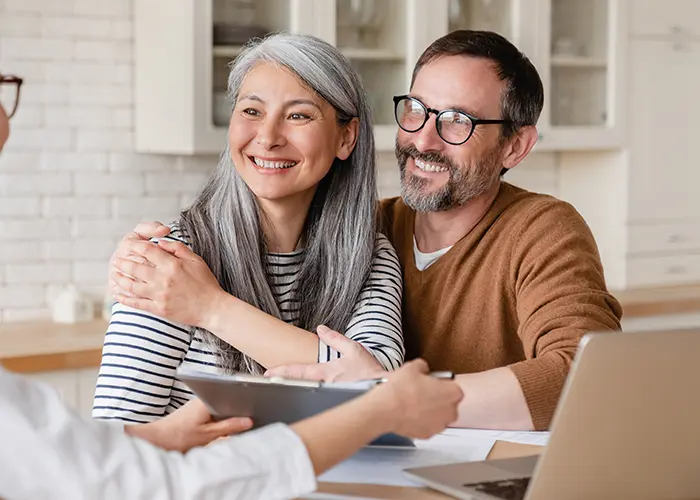 Older couple planning for retirement with financial advisor