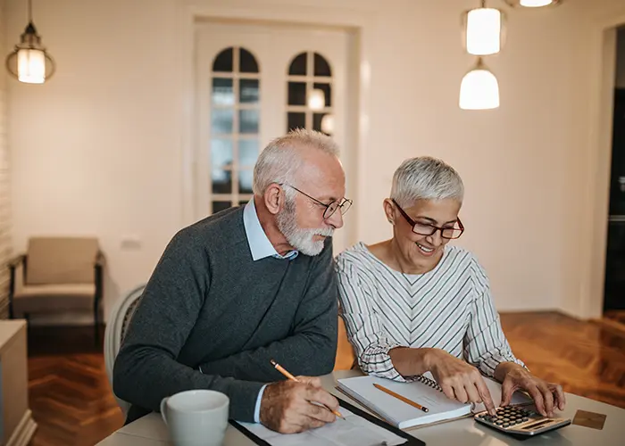 Retired couple looking over their finances
